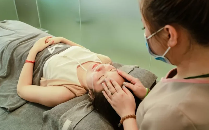 A soothing facial massage session promoting relaxation and wellness at a spa.